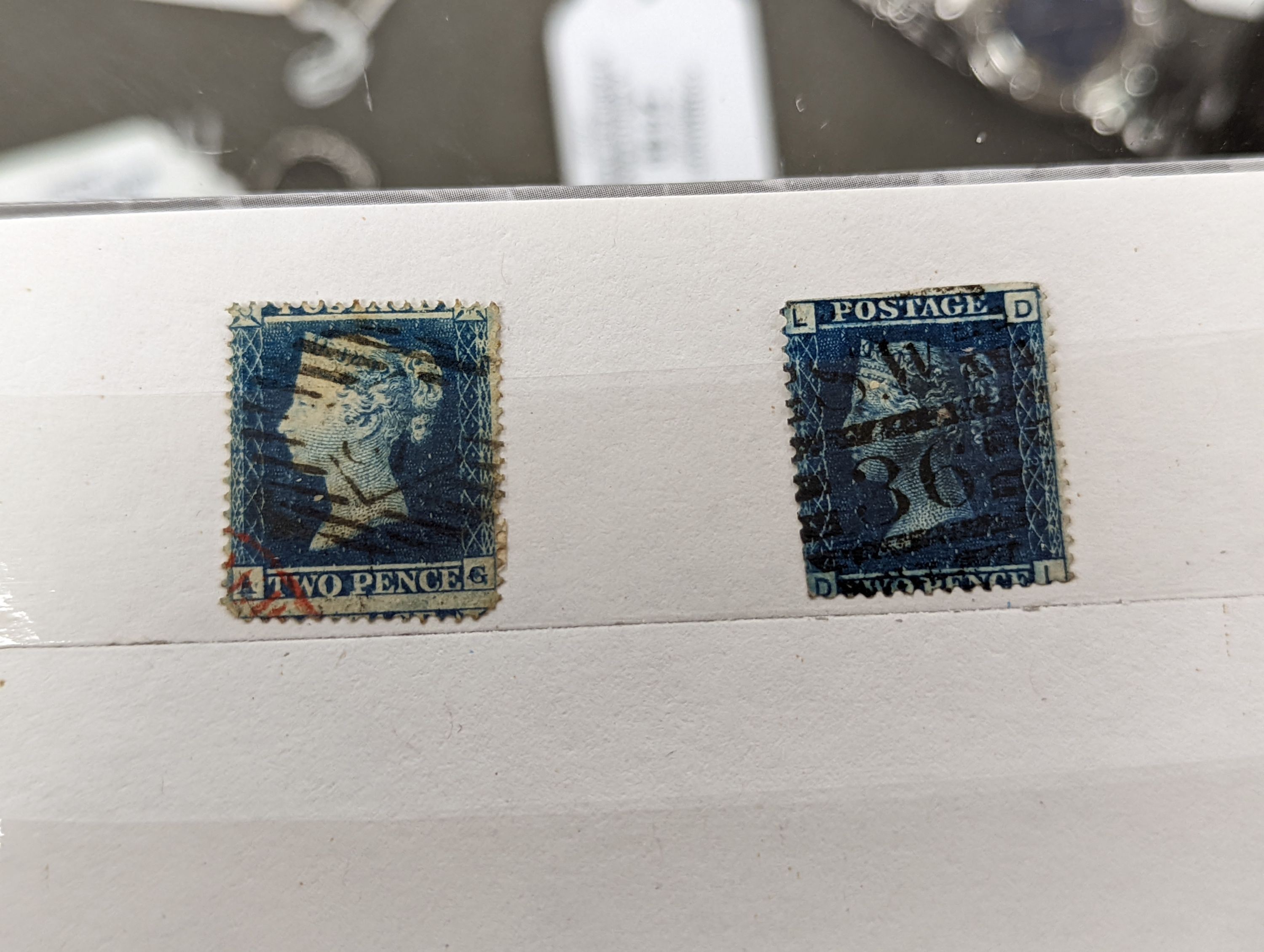 Great Britain - small stock book 2d blues with 1841 2d used strip of three, 6 singles used. 1858 2d plate 13 and plate 14 mint blocks of four